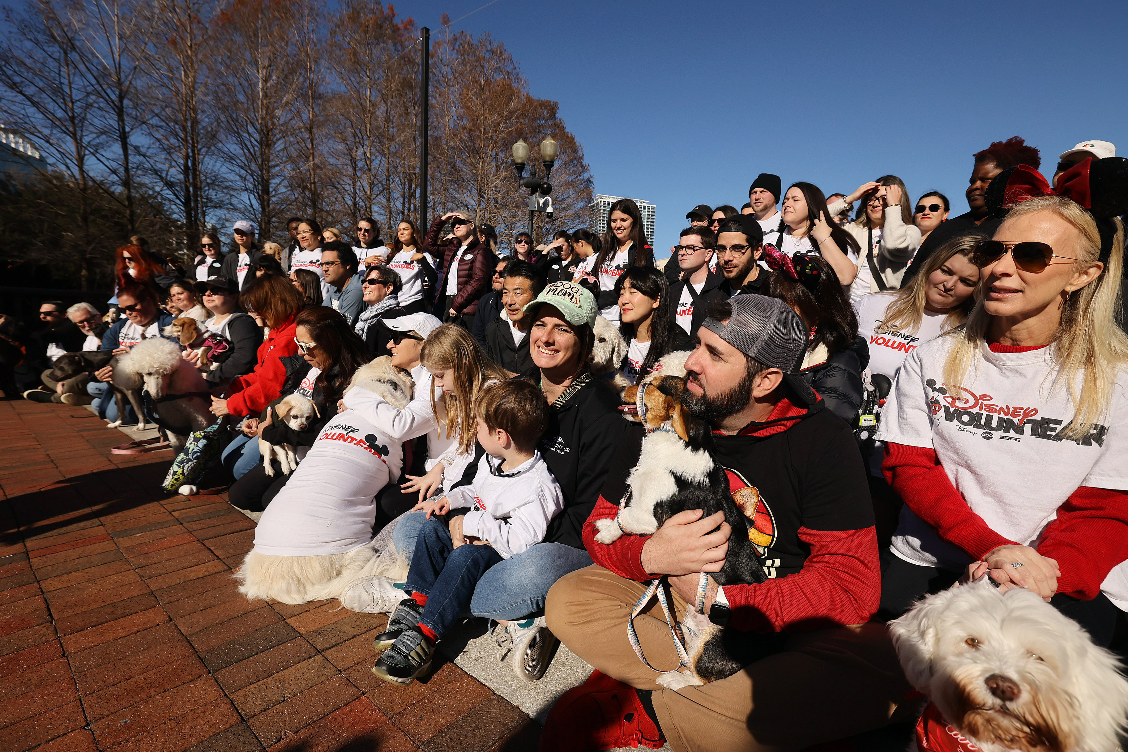Dog lovers gather with their pets for a group photo...