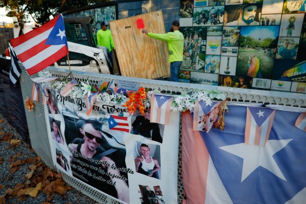 A crew begins the process of removing items from the Pulse Nightclub site on Monday, December 22, 2025, as the effort to demolish the sitewhere the mass shooting occurred in June 2016begins, making way for a permanent memorial. Items being removed and stored include chandeliers, large posters, a cash register and other interior decorative items. (Rich Pope/ Orlando Sentinel)
