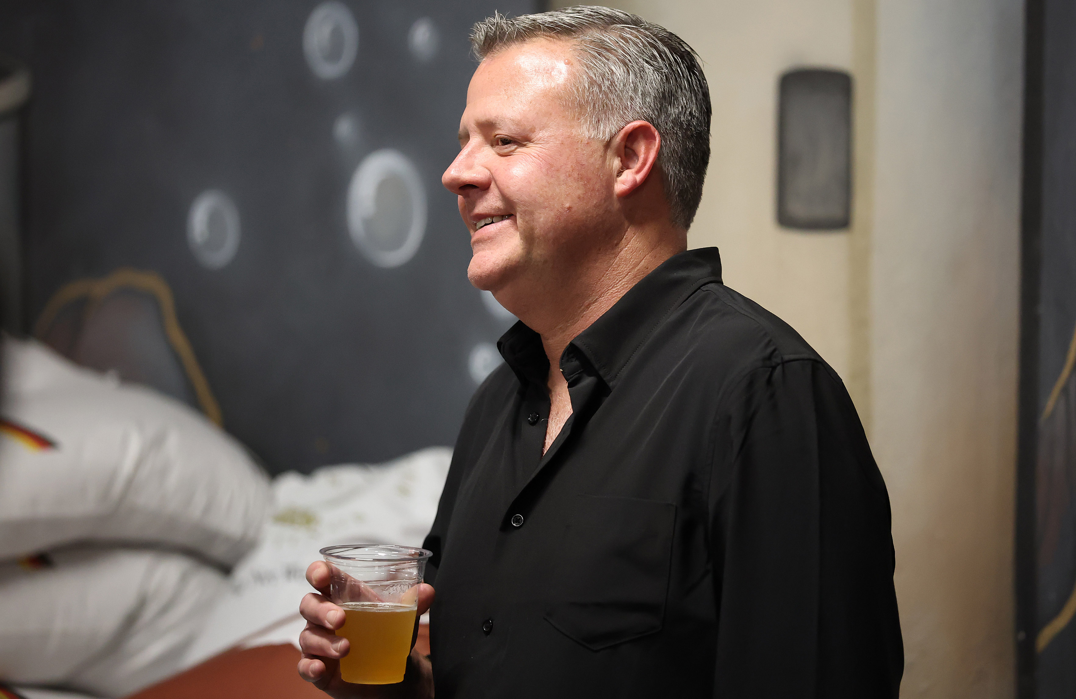 Orlando Sentinel columnist Scott Maxwell listens to a speaker during...