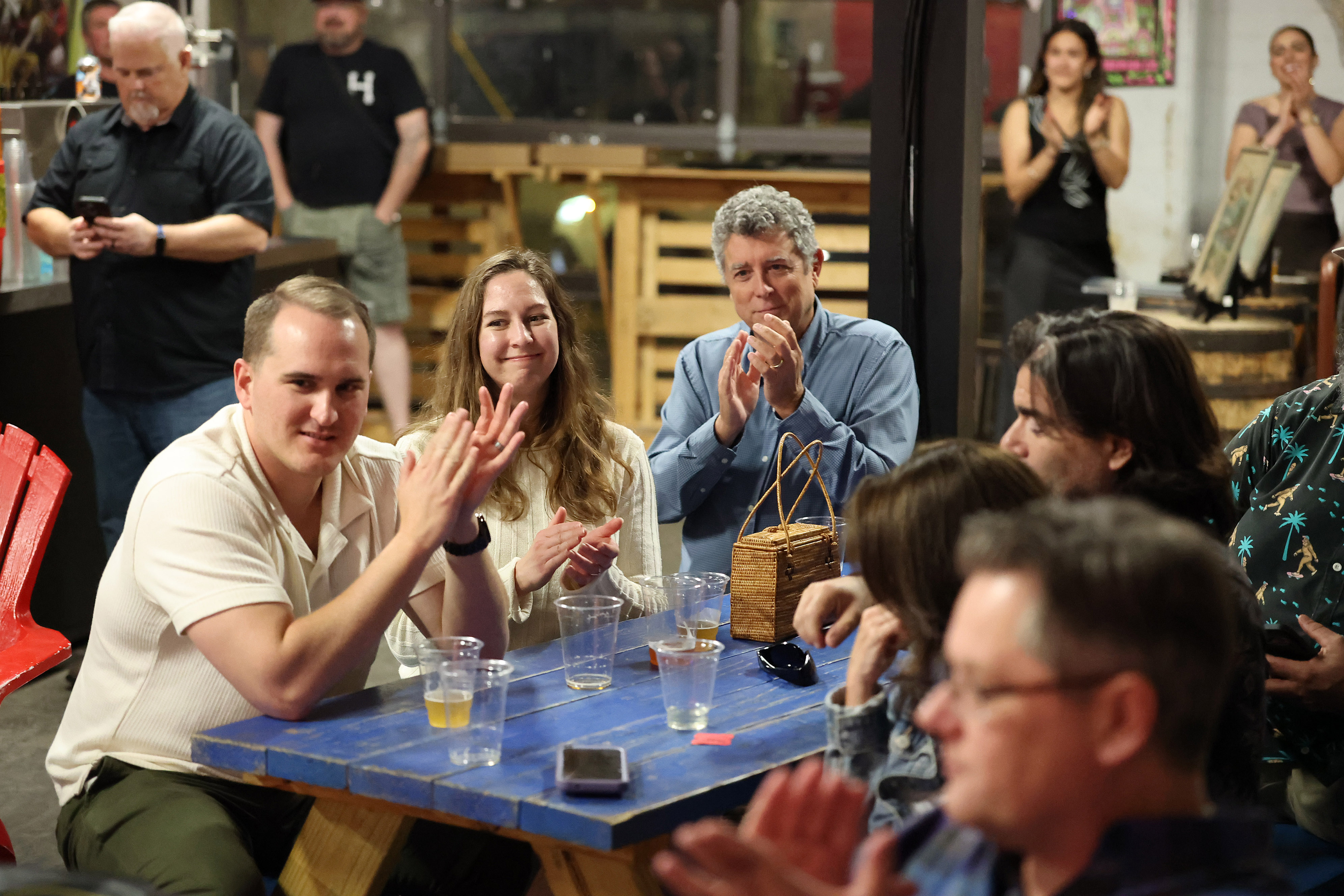 Attendees applaud during a gathering celebrating the Orlando Sentinelâs 150th...