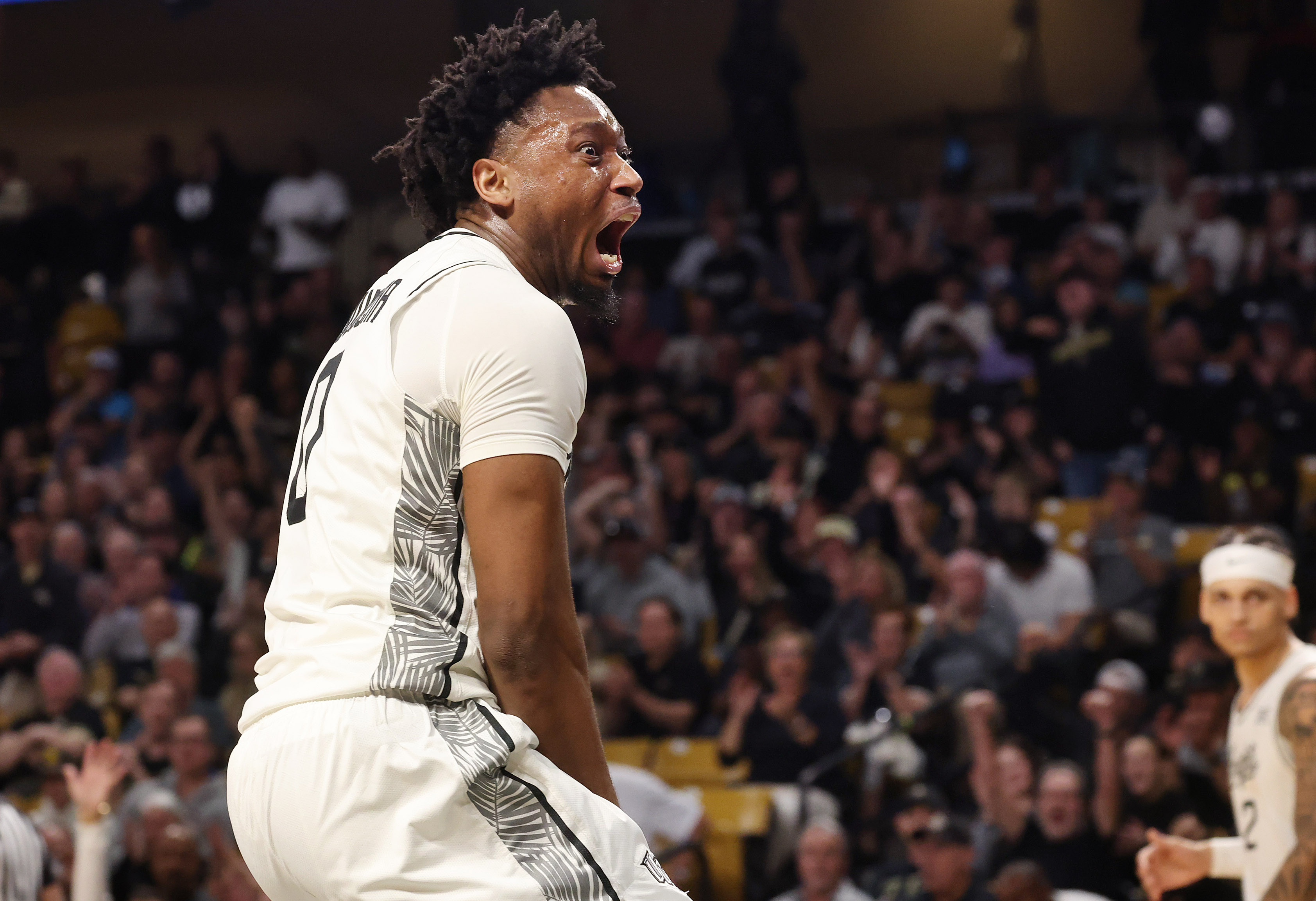 UCF center Jeremy Foumena screams in celebration after scoring during...