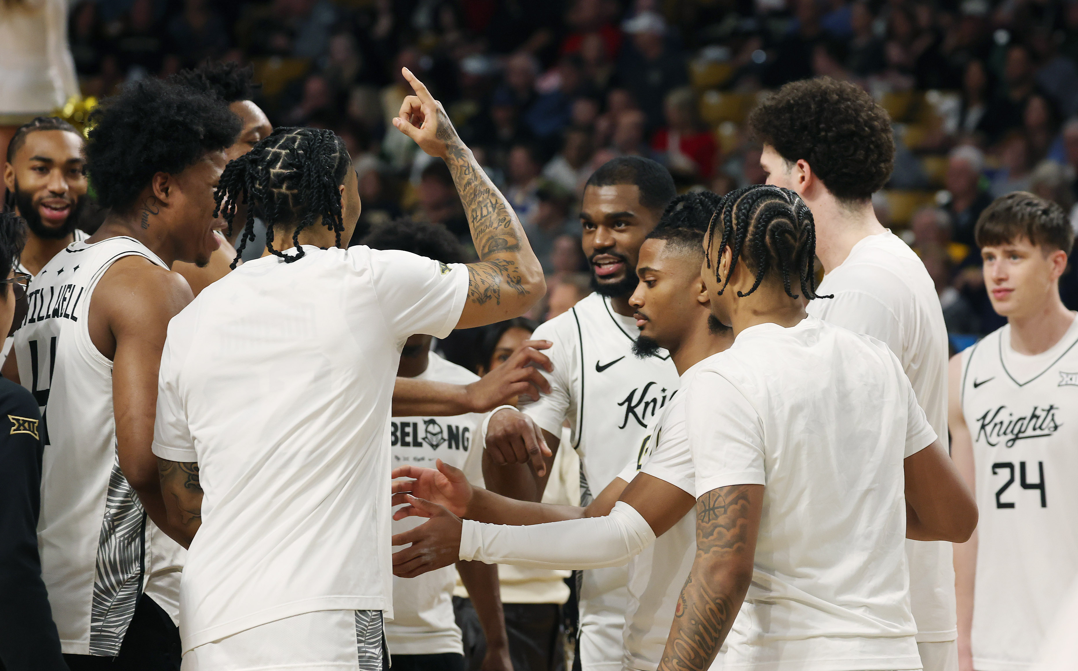 UCF players gather during the West Virginia at UCF college...