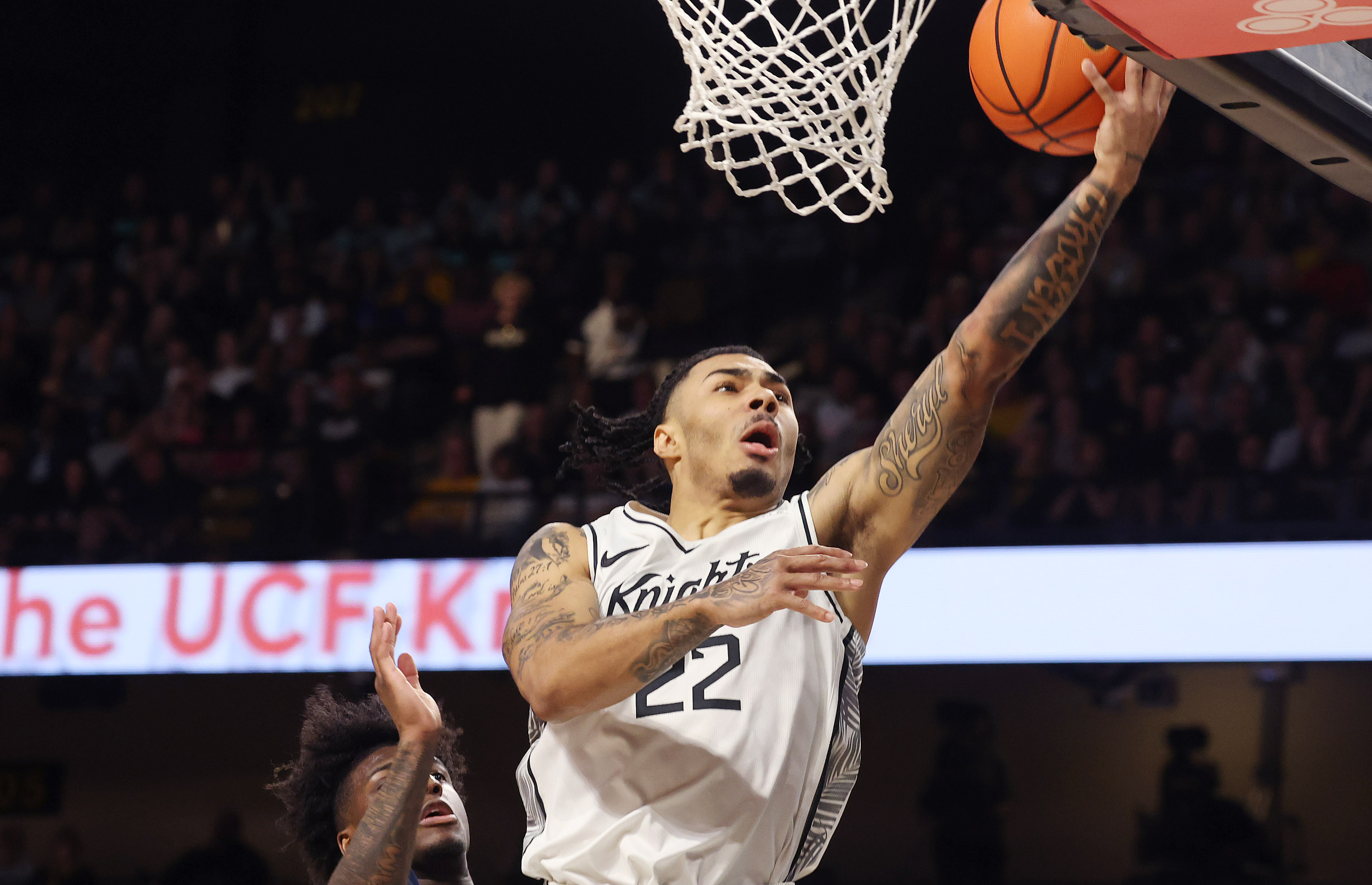 UCF guard Chris Johnson scores during the West Virginia at...