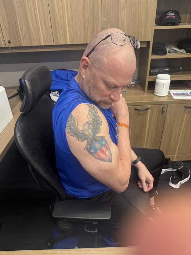 When Florida strength coach Rusty Whitt's service ended with the Green Berets, he got a tattoo on his left arm of the American seal found on the back of the dollar bill. (Edgar Thompson/Orlando Sentinel)