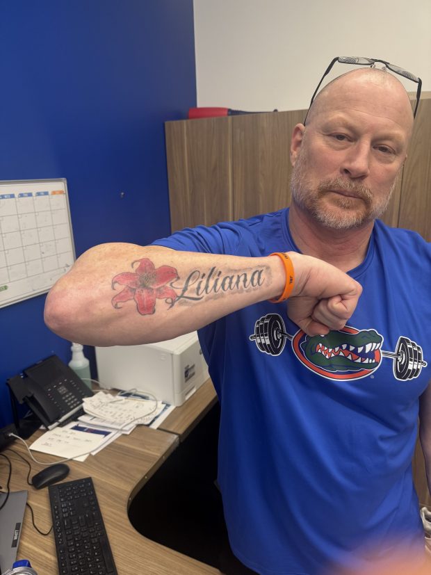 Florida coach Rusty Whitt's left forearm features a tattoo with the name of his 13-month daughter Lilanna. (Edgar Thompson/Orlando Sentinel)