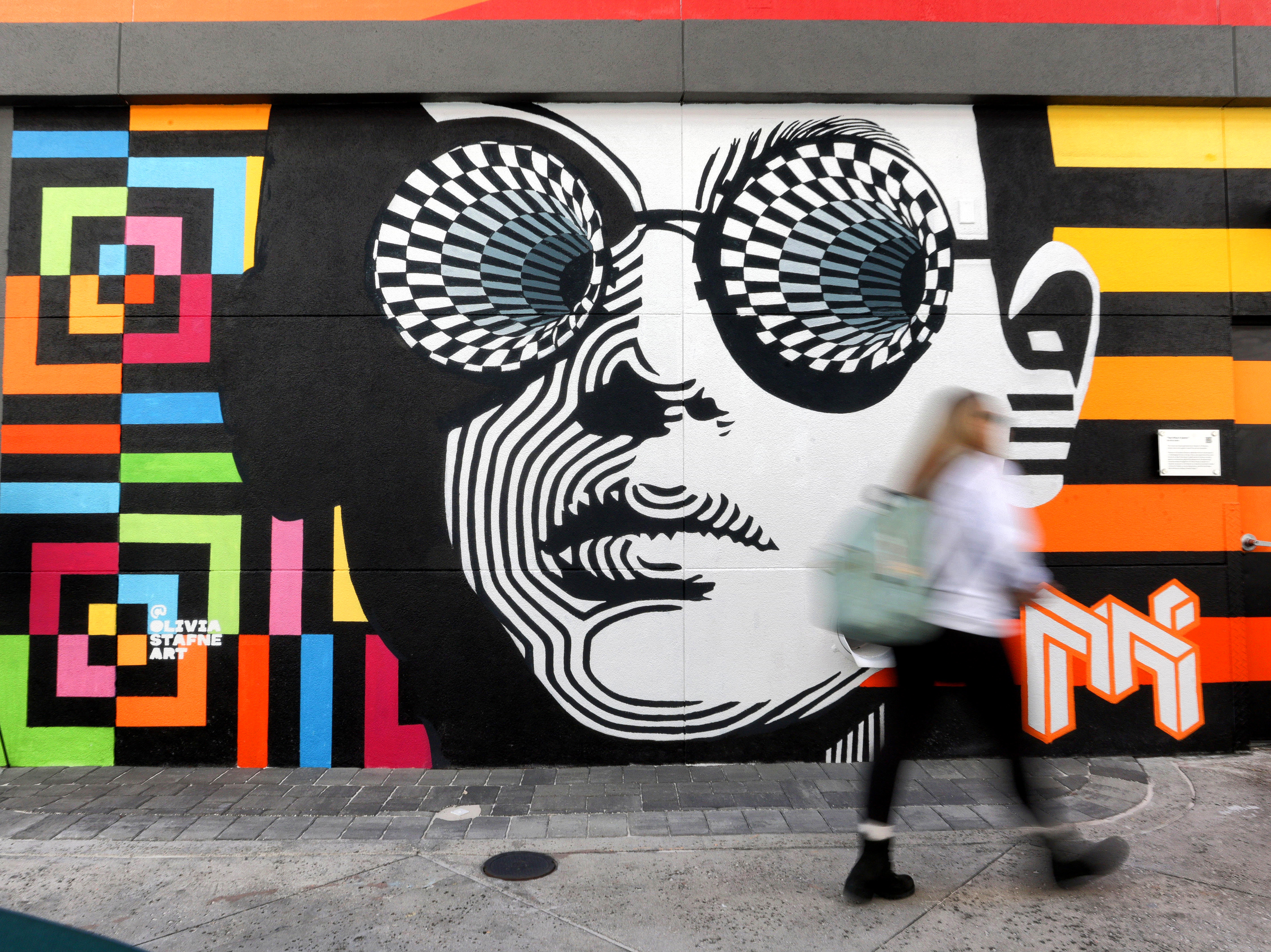 ART AT THE ICON â A guest walks past the...