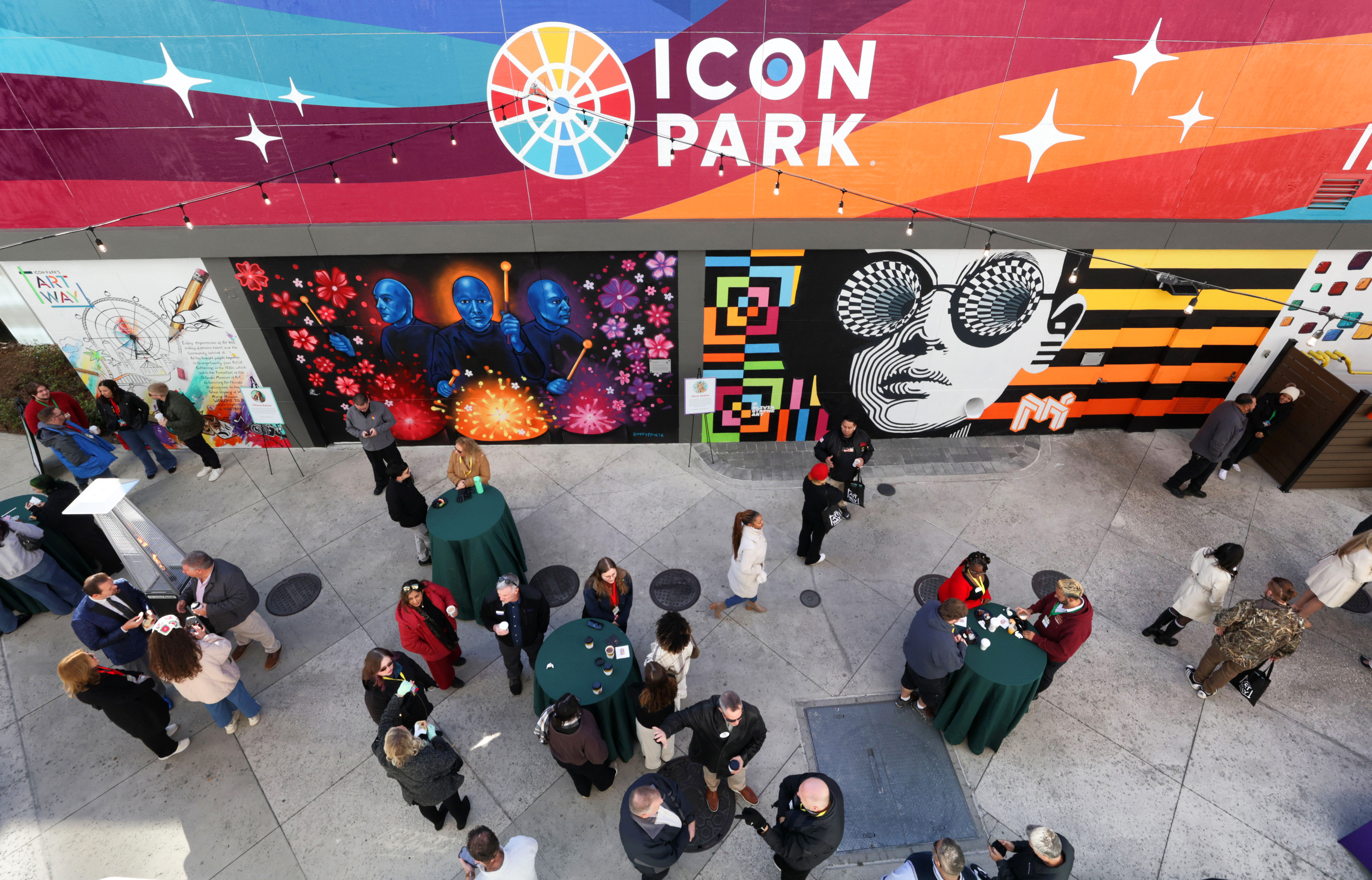 ART AT THE ICON â Guests check out the murals...