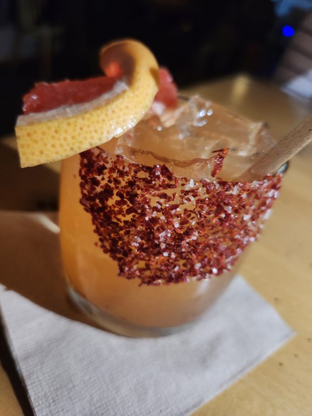 Bōshi Bar's menu includes funky cocktails, like this Tajin-dusted paloma, but a full bar means libation choices are wide open. (Amy Drew Thompson/Orlando Sentinel)