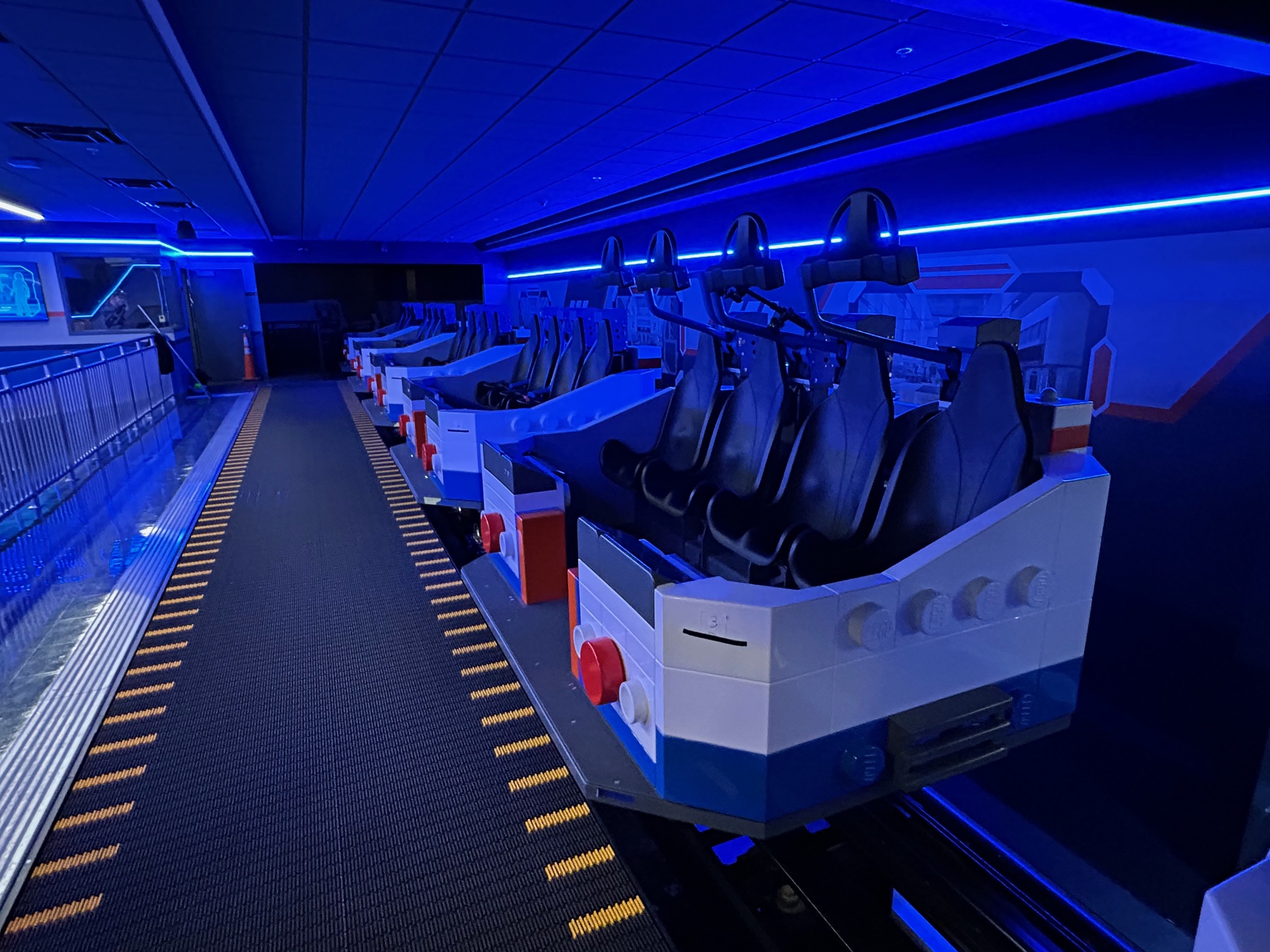 The spinning ride vehicles for Galacticoaster include a lap bar...