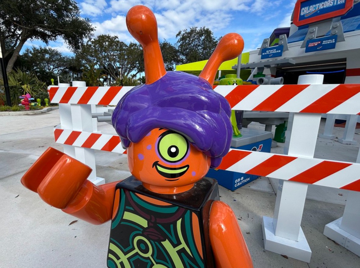 An upsided minifigure is one of the aliens that greets...