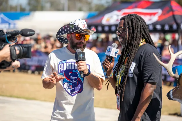 Florida Man Games founder Pete Melfi and social media star Josh Wicks Robinson offer commentary during the Florida Man Games at the Freedom Factory in Bradenton on Feb. 21, 2026. (Patrick Connolly/Orlando Sentinel)