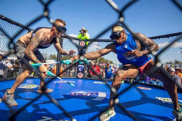 Teams face off in a "taser tag" event with cattle prods during the Florida Man Games at the Freedom Factory in Bradenton on Feb. 21, 2026. (Patrick Connolly/Orlando Sentinel)