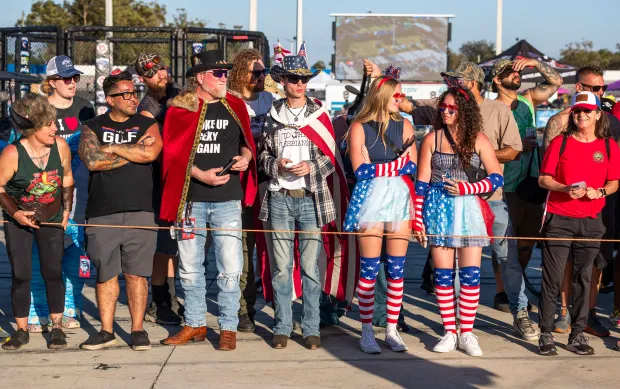 Spectators clad in America and Florida-centric gear watch the festivities during the Florida Man Games at the Freedom Factory in Bradenton on Feb. 21, 2026. (Patrick Connolly/Orlando Sentinel)