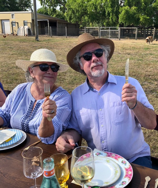 Longtime partners Jennifer Greenhill-Taylor and Joseph Hayes dine al fresco at Lake Meadow Naturals farm dinner, 2017. (Photo courtesy Jennifer Greenhill-Taylor)