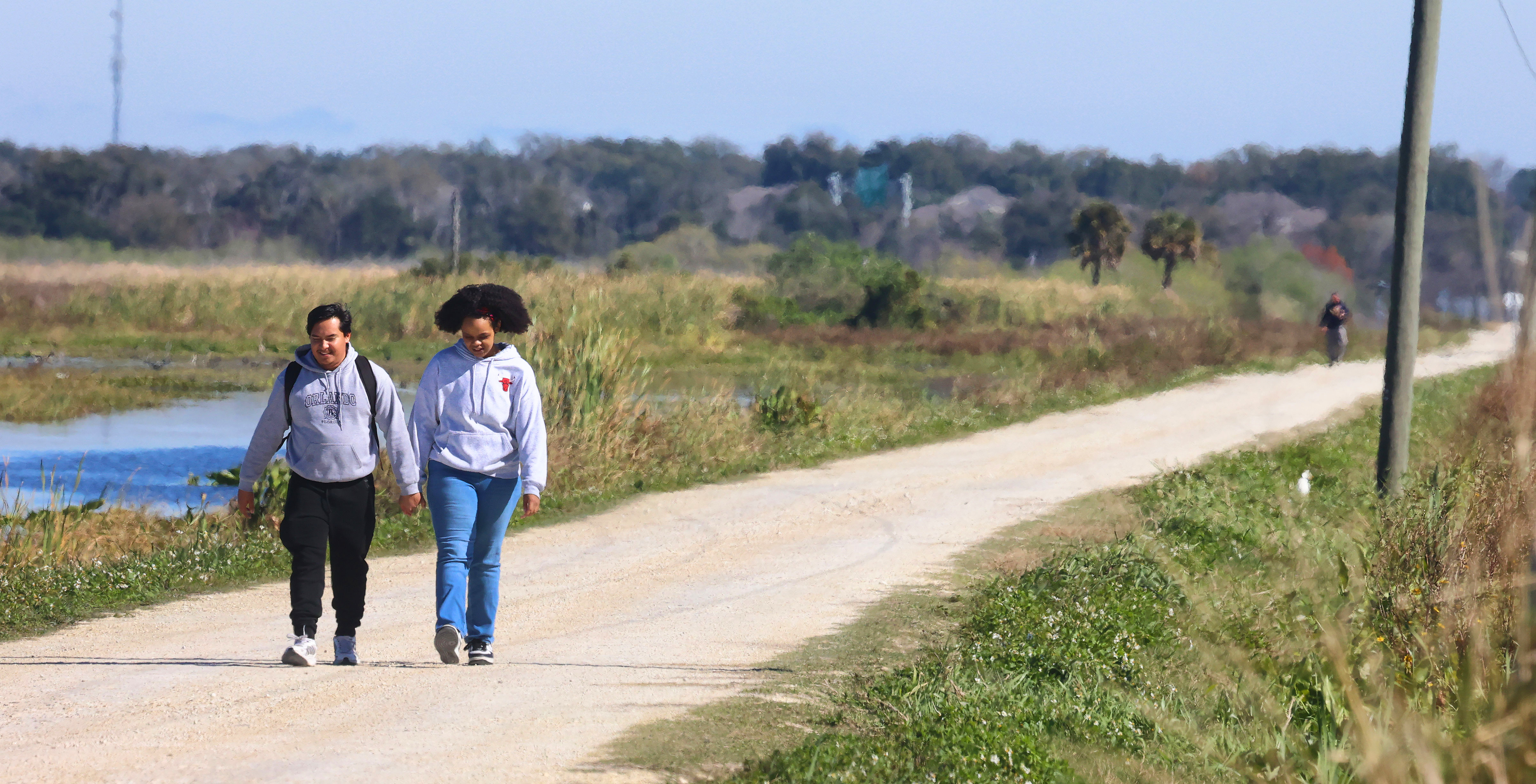 Visitors hike along the wetlands on the Lake Apopka Wildlife...