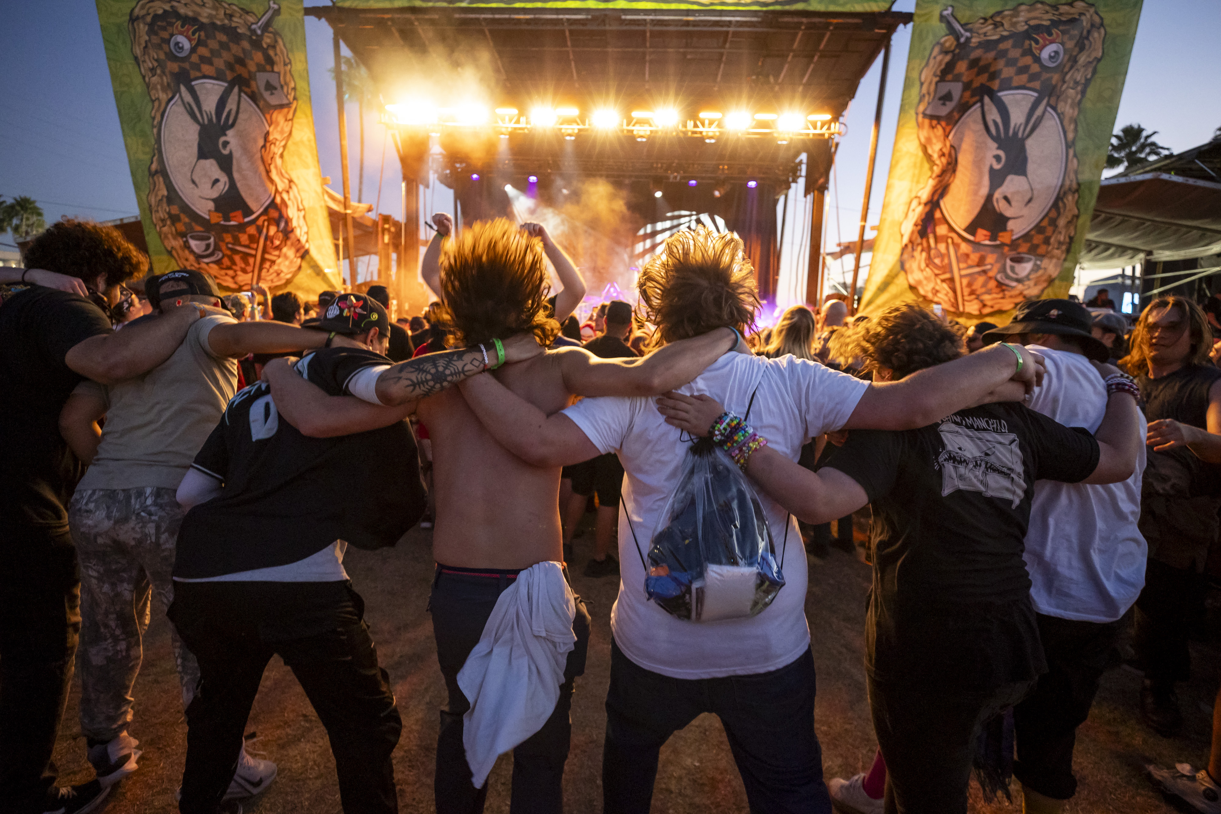 Fans headbang while Dinosaur Pile-Up performs at the Owenâs Mixers...