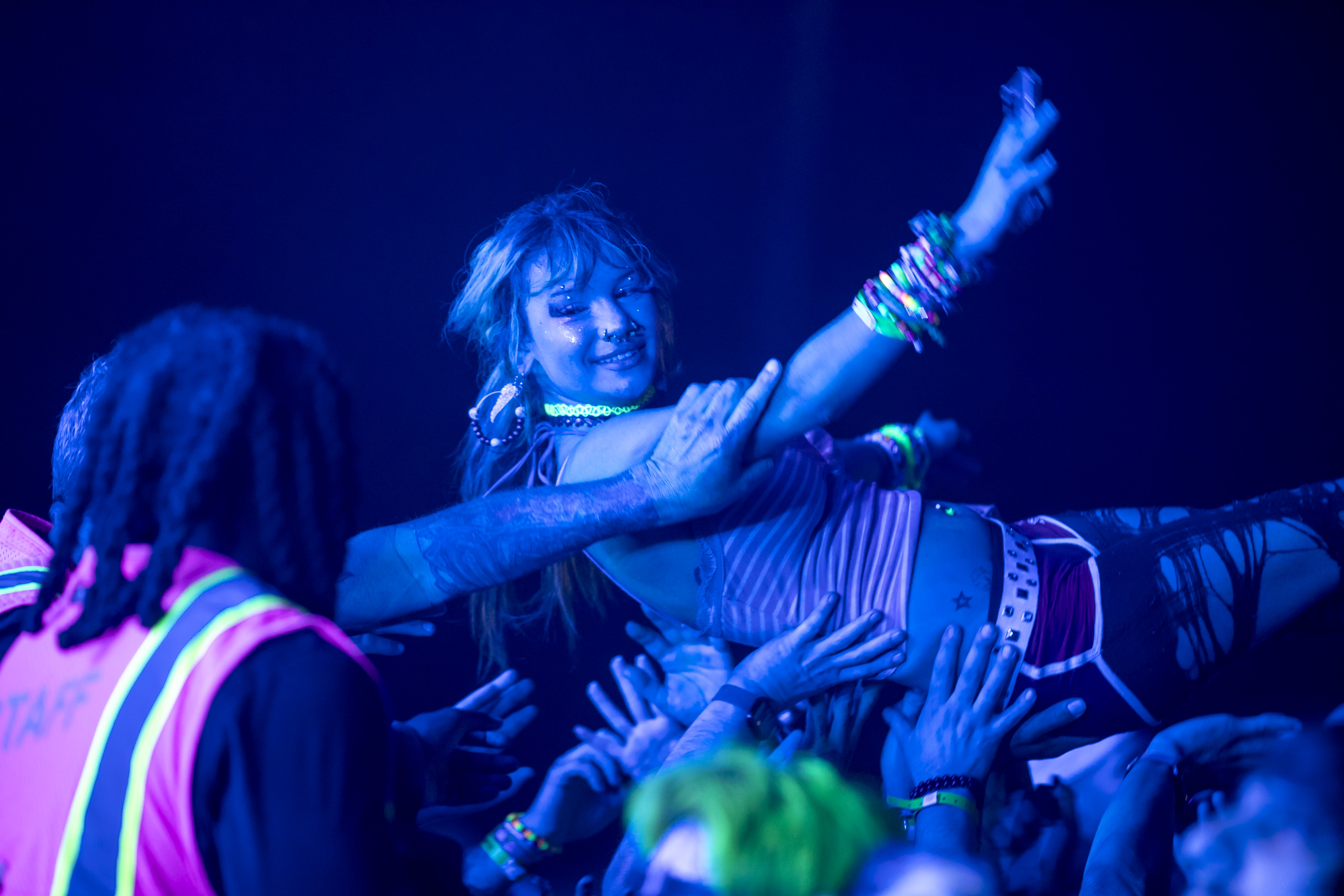 A fan crowdsurfs as Streetlight Manifesto performs during Vans Warped...
