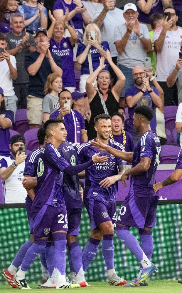 Orlando City fans clap for Orlando City midfielder Martín Ojeda (10) after his score during the soccer match against CF Montréal at the Inter & Co Stadium in Orlando, Fla., Saturday, July 12, 2025. (Willie J. Allen Jr./Orlando Sentinel)