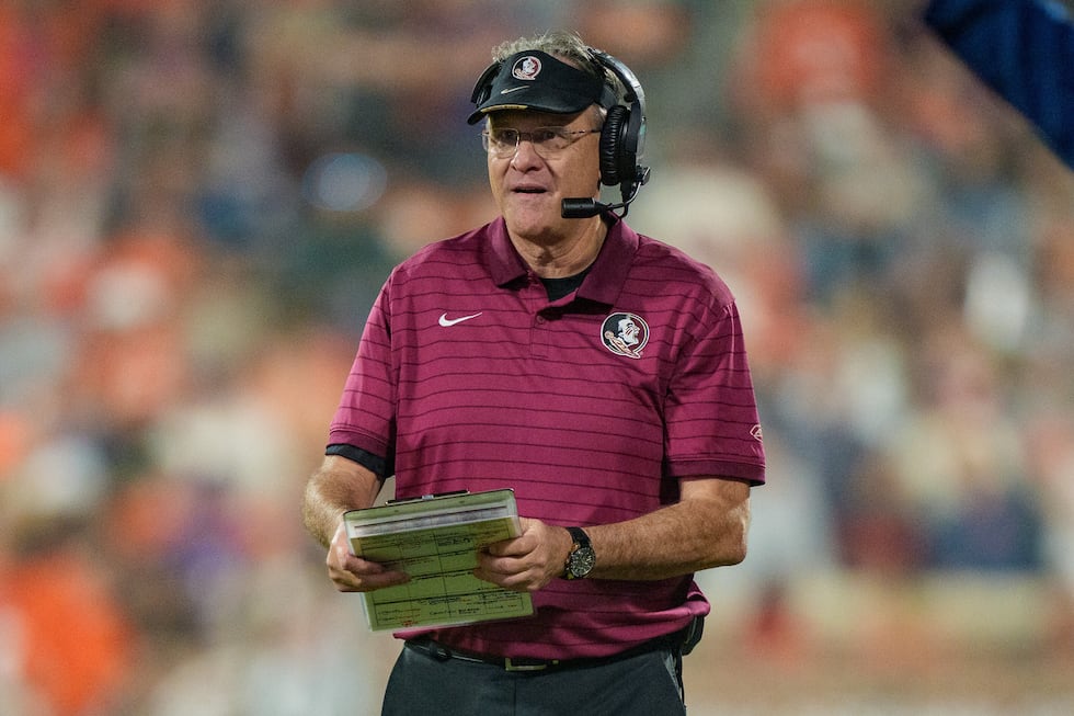Florida State offensive coordinator Gus Malzahn looks on during an NCAA college football game...