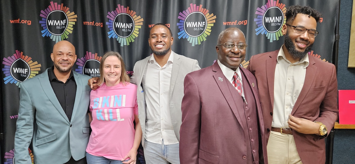 A group portrait from a Tampa Mayoral discussion at WMNF 88.5 FM. Pictured from left to right are Tres L. Rodmon, Tampa City Councilwoman Lynn Hurtak in a pink Bikini Kill shirt, Anthony Gilbert Jr., Reginald B. Strachan, and Alan Henderson.