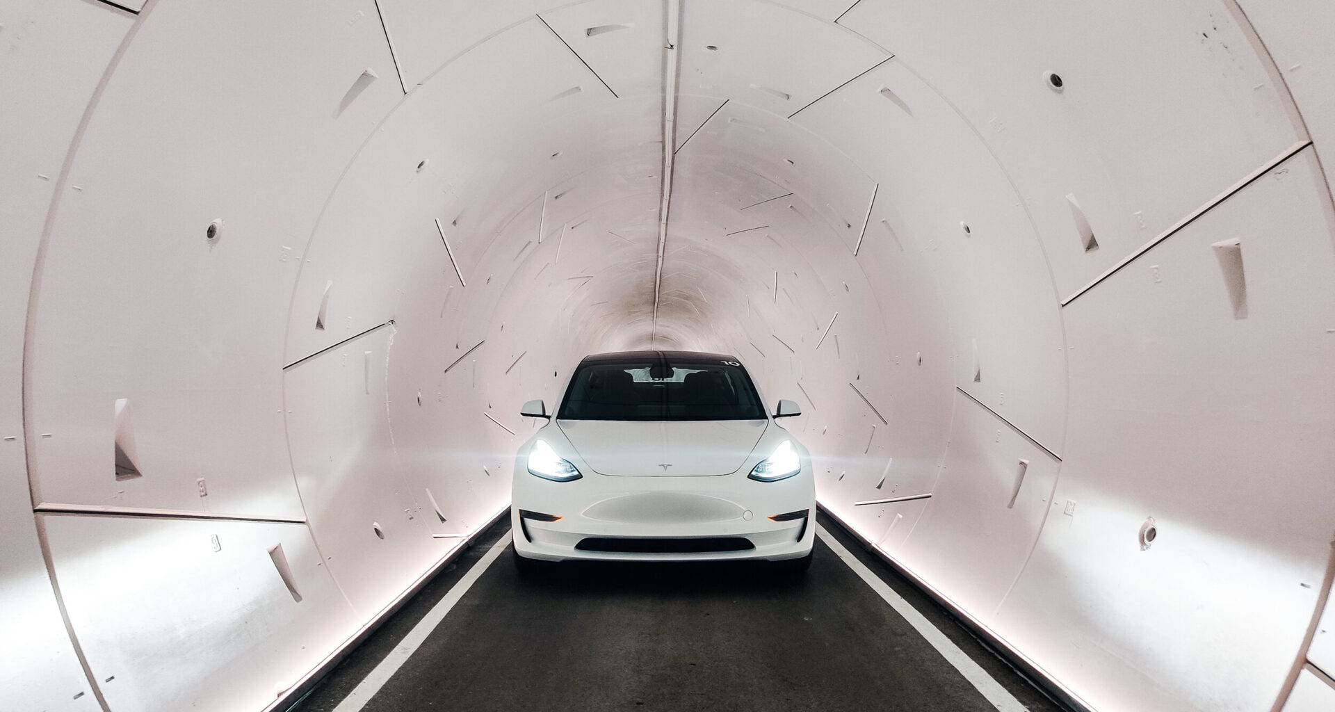 A Tesla travels through a Boring Company tunnel
