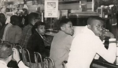 An old photo of students sitting at a lunch counter