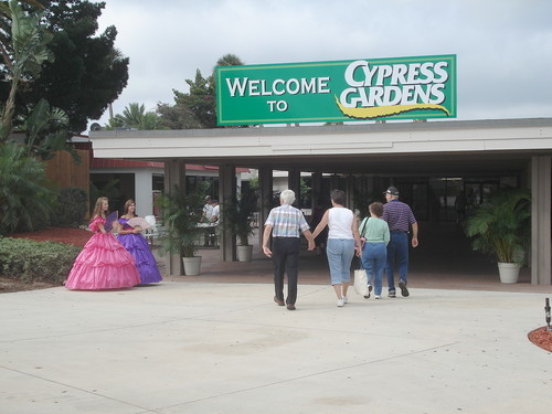 Women dressed as Southern belles greet guests to newly reopened...
