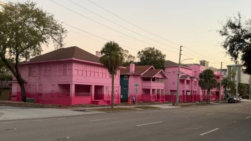 Several low-rise apartment buildings painted bright pink at 4th Street South and 4th Avenue South in downtown St. Petersburg.