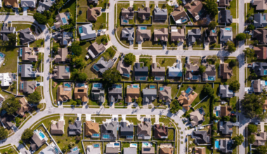 Aerial view of suburban homes in Tampa Bay, showing residential streets, backyards and pools.