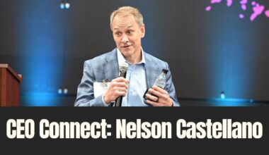 Nelson Castellano speaks during TBBW’s January CEO Connect event, holding a microphone on stage.