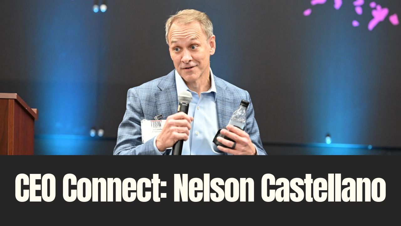 Nelson Castellano speaks during TBBW’s January CEO Connect event, holding a microphone on stage.