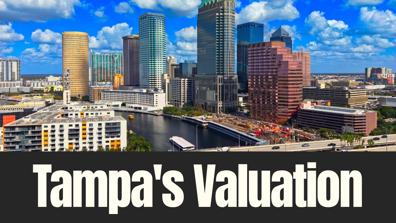 Downtown Tampa skyline along the Hillsborough River showing office towers and active construction in a fast-growing real estate market.