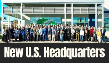 Employees, business leaders and officials stand outside a new U.S. headquarters building during a ribbon-cutting event in Palmetto, Florida.