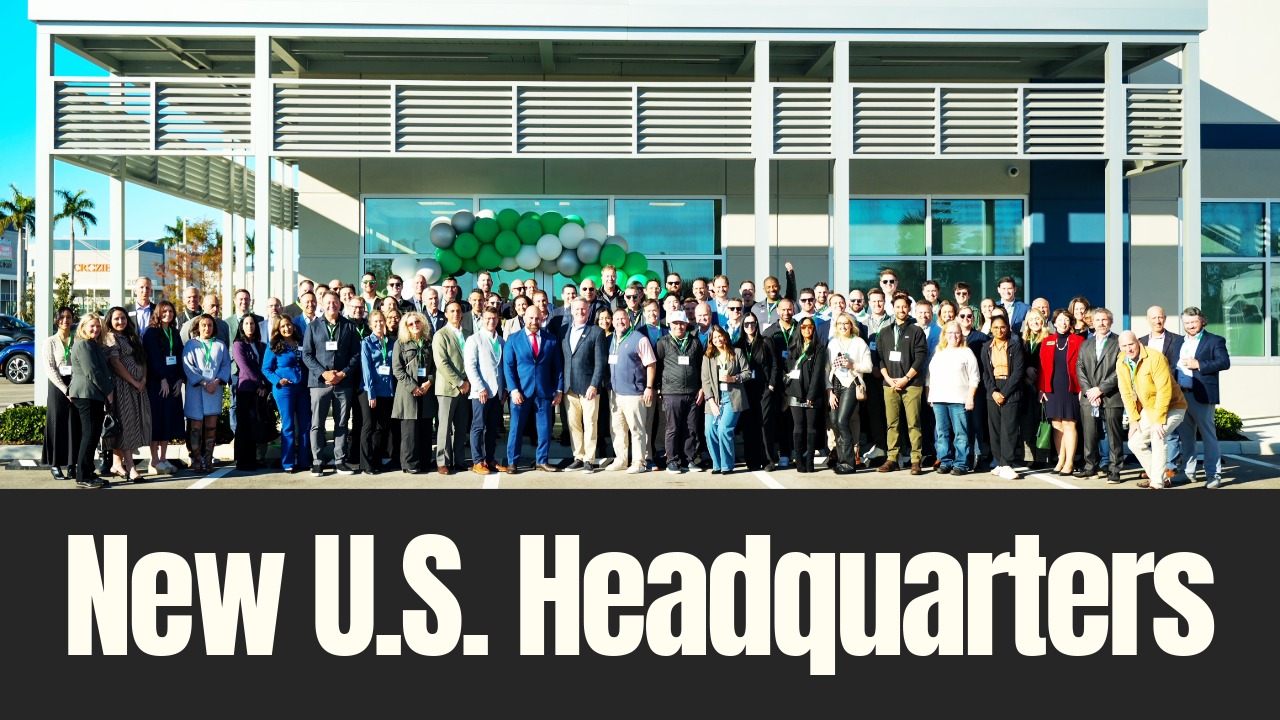 Employees, business leaders and officials stand outside a new U.S. headquarters building during a ribbon-cutting event in Palmetto, Florida.