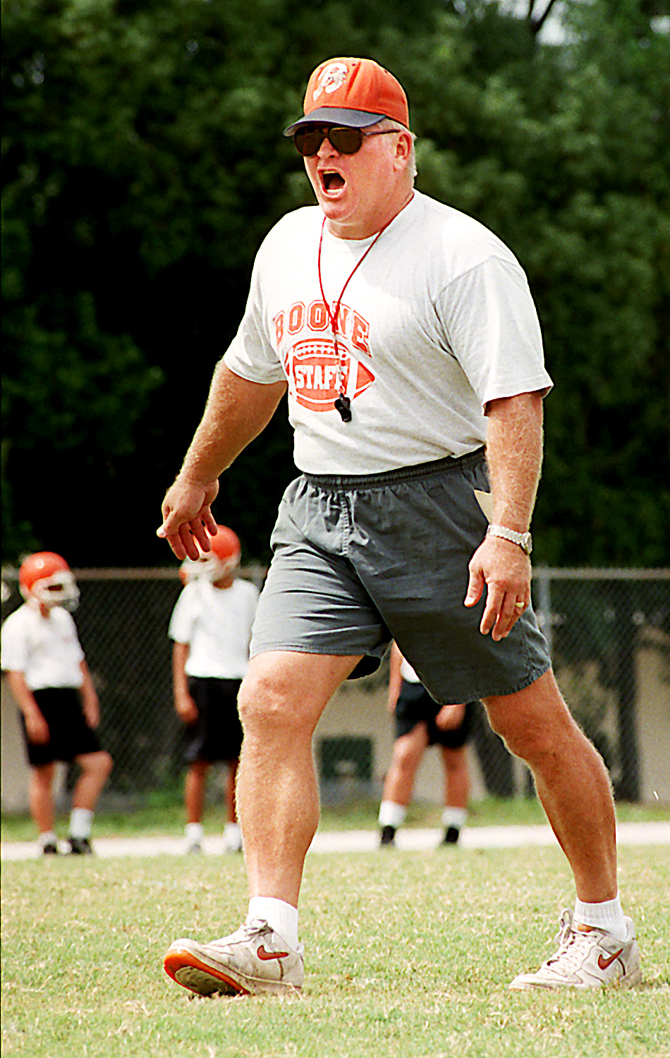 Boone High School football coach Phil Ziglar shouts instructions during...