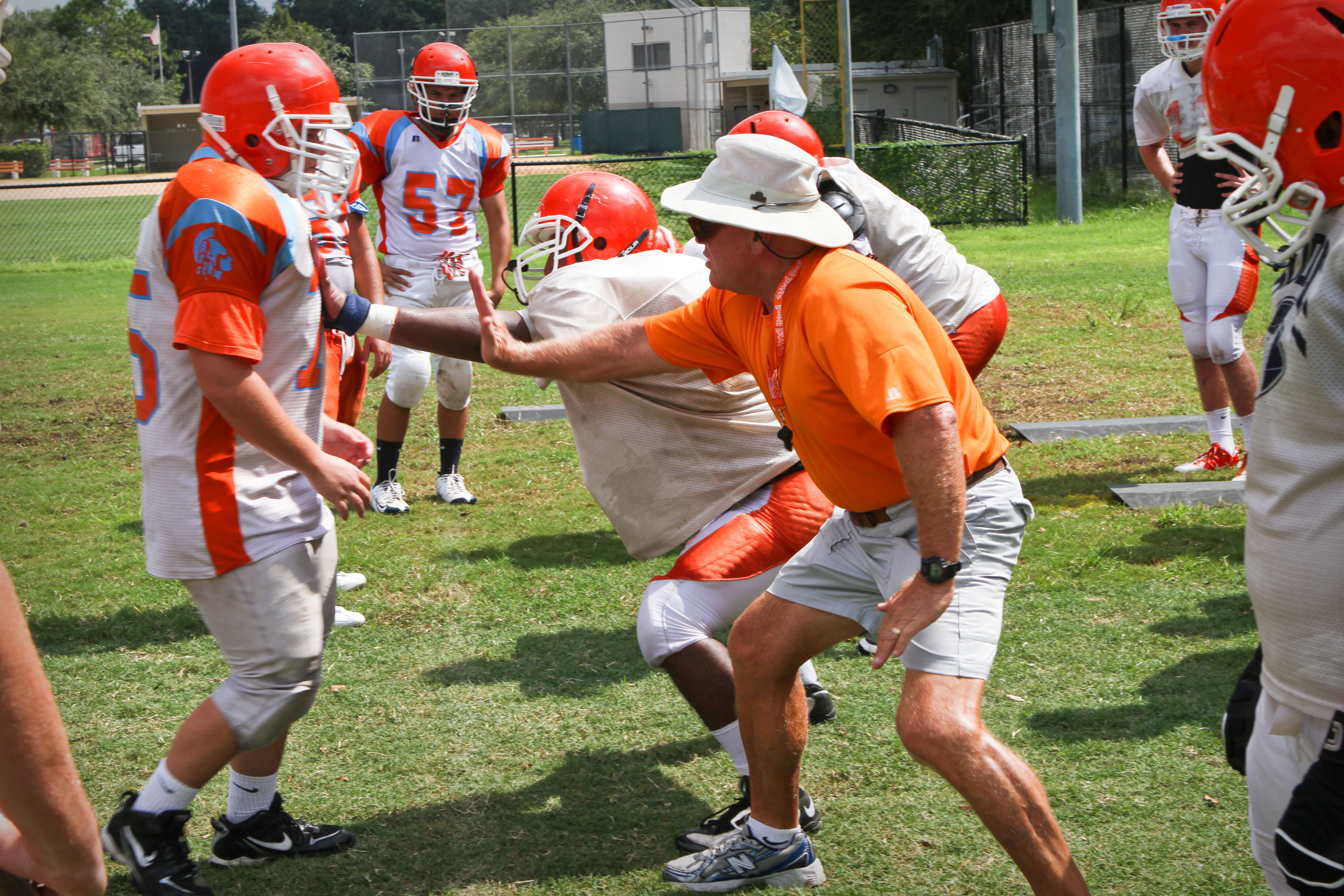 Coach Phil Ziglar runs drills during football practice at Boone...