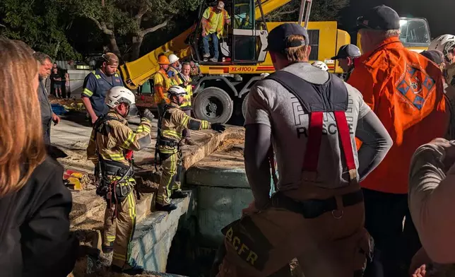 This photo provided by Brevard County Fire Rescue shows members of Brevard County Fire Rescue help rescue a manatee that was stuck in a storm drain on Monday, Feb. 9, 2026 in Melbourne Beach, Fla. (Brevard County Fire Rescue via AP)