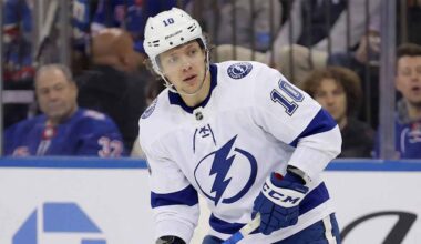 A concept illustration showing current New York Rangers forward Artemi Panarin wearing a white Tampa Bay Lightning away jersey with the number 10, blue pants, and blue gloves, standing on the ice and looking towards the left.
