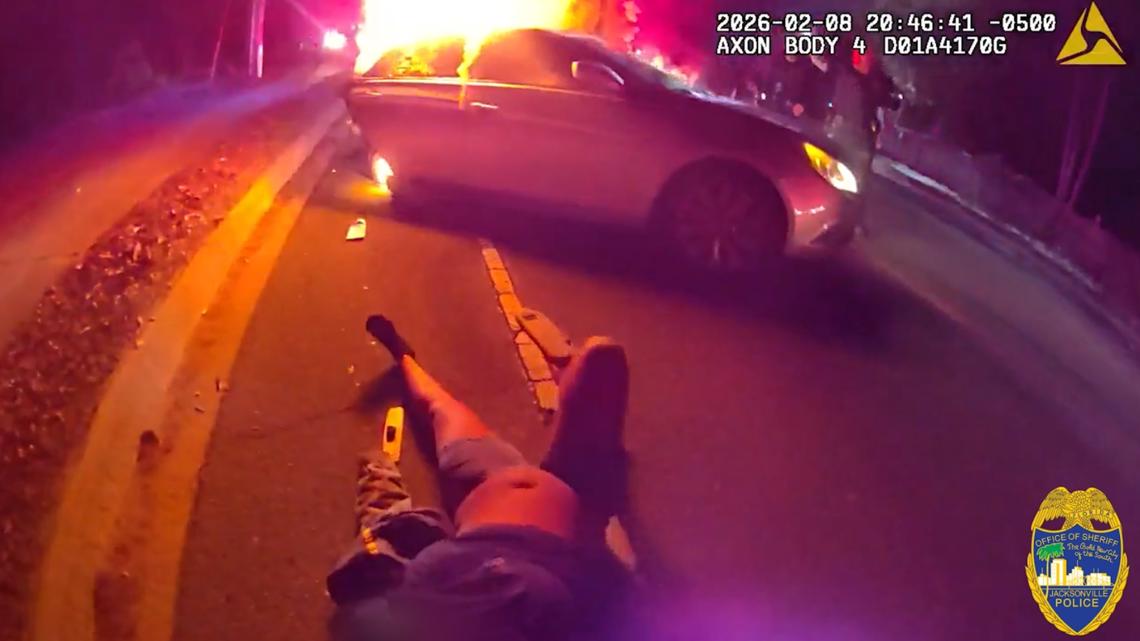 WATCH: Officer pulls woman from burning car after reported carjacking-turned-crash in Jacksonville