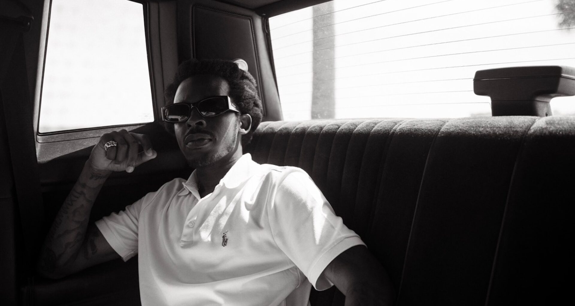 Photo of a man sitting inside a car