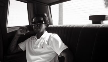 Photo of a man sitting inside a car