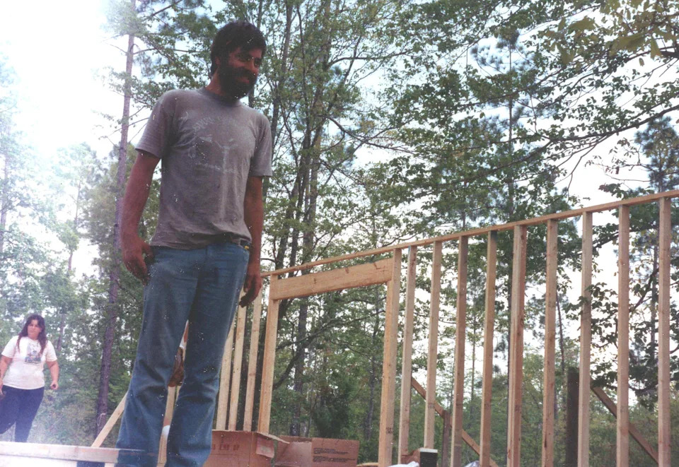 Doug Alderson working on his house around 1987.