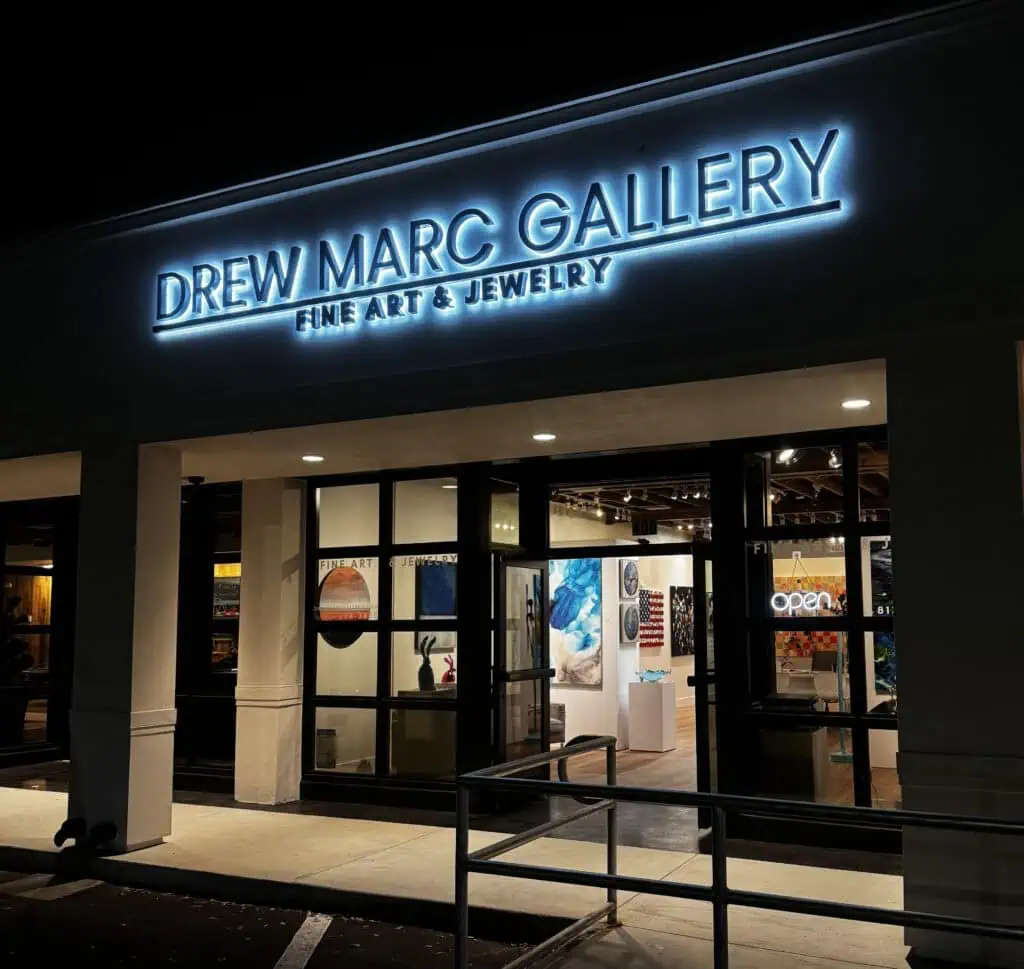 The exterior of a shop at night
