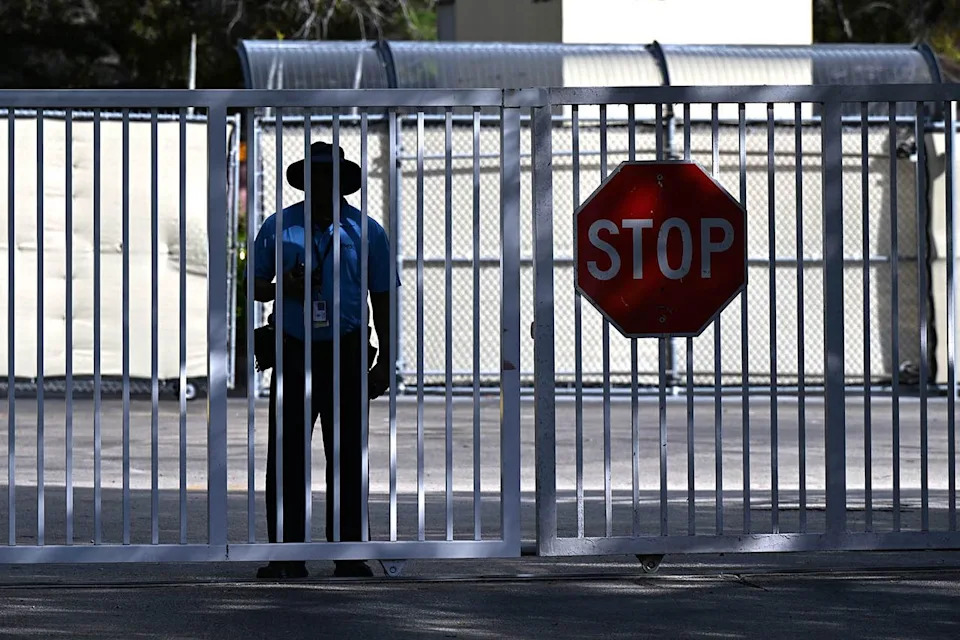 A guard stands at the gate of the Broward Transitional Center ICE Facility in Pompano Beach, Fla., on Jan. 11, 2026 Larry Marano/Shutterstock 