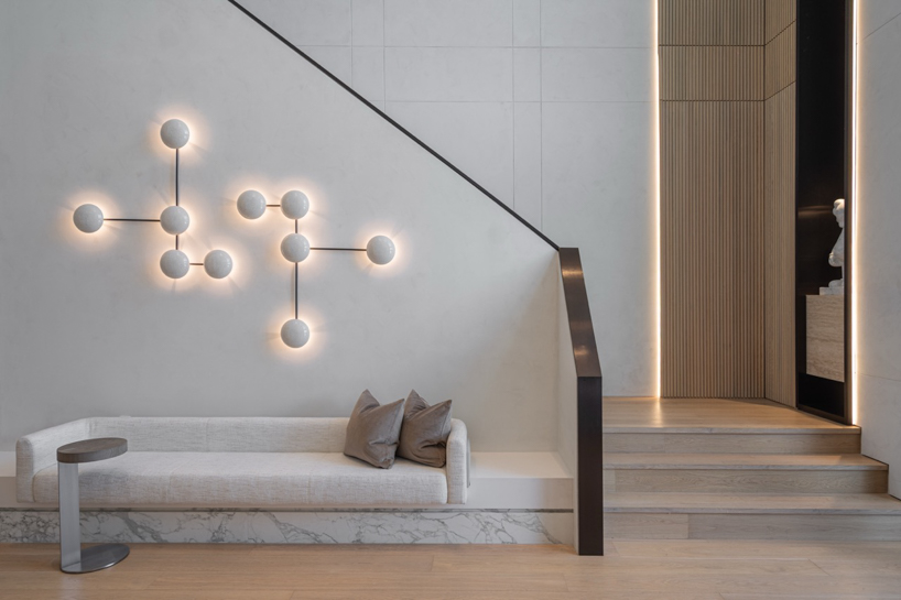 wood and porcelain interplay across curved interiors in florida renovation