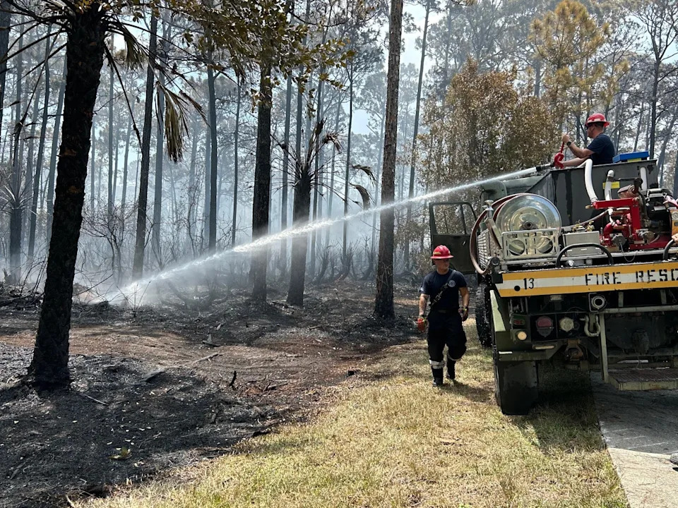 A brush fire on land off Oslo Road between 20th and 27th avenues southwest grew to about 23 acres leading to the evacuation of the Bradford Place condominium community July 27, 2025. Mop-up efforts continued July 28 to ensure the fire did not reignite.
