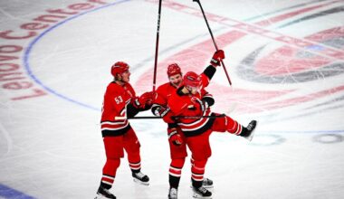 Right wing Jackson Blake (left) and defenseman Dimitri Orlov (middle) celebrate with center Sebastian Aho after a goal during the game against the Columbus Blue Jackets in the Lenovo Center on Thursday, Jan. 23, 2025. The Hurricanes scored five goals in the second period. Carolina defeated Columbus 7-4.