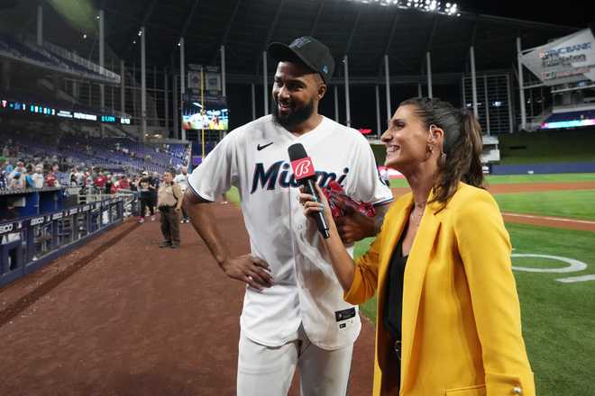 MIAMI, FL - APRIL 04: Sandy Alcantara #22 of the Miami Marlins talks with Bally Sports reporter Kelly Saco after throwing a complete game shutout against the Minnesota Twins at loanDepot park on April 4, 2023 in Miami, Florida. (Photo by Jasen Vinlove/Miami Marlins/Getty Images)