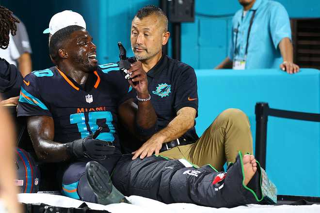 New York Jets v Miami Dolphins - NFL 2025 MIAMI GARDENS, FLORIDA - SEPTEMBER 29: Tyreek Hill #10 of the Miami Dolphins leaves the field following an injury during the third quarter against the New York Jets at Hard Rock Stadium on September 29, 2025 in Miami Gardens, Florida. (Photo by Megan Briggs/Getty Images)