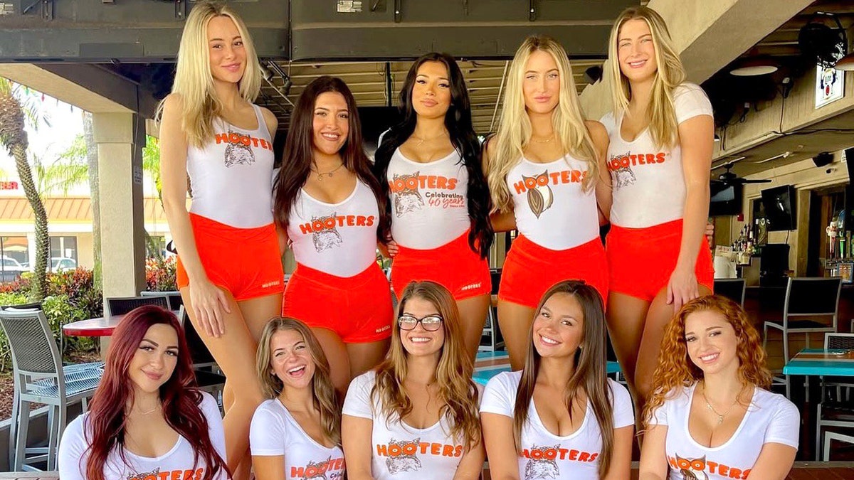 Hooters girls pose for a photograph outside the Boca Raton, Florida, location.